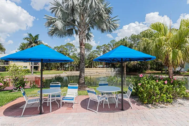 View of patio featuring fence and outdoor dining area