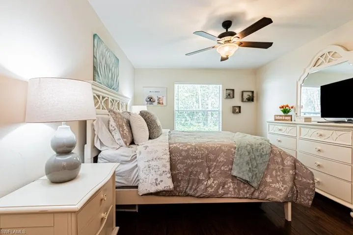 Bedroom featuring dark wood finished floors and ceiling fan