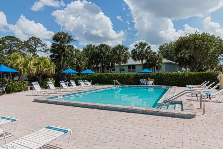 Pool featuring fence and a patio area