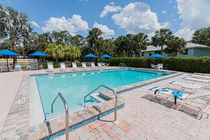 Community pool with a patio area