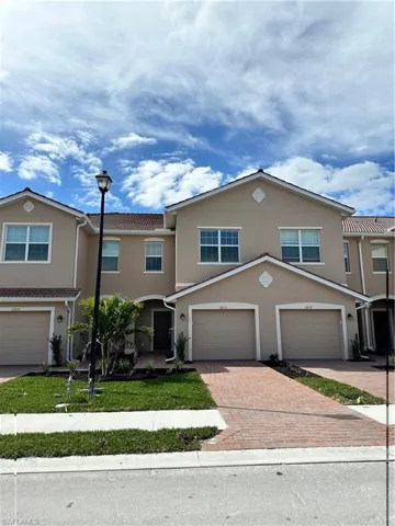 View of property featuring a garage