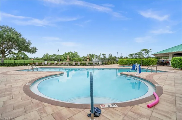 Community pool with a patio area