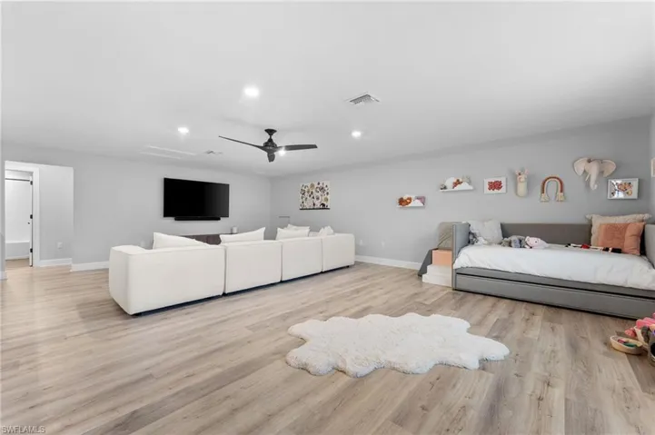 Bedroom with light wood-type flooring and ceiling fan