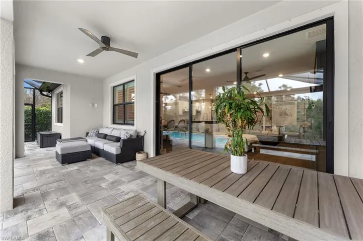 View of patio featuring an outdoor hangout area and ceiling fan