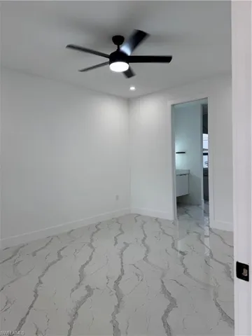 Unfurnished room featuring ceiling fan