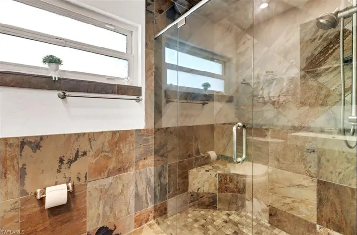 Bathroom featuring a shower with shower door