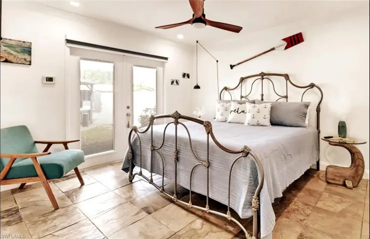 Bedroom featuring ceiling fan and access to outside