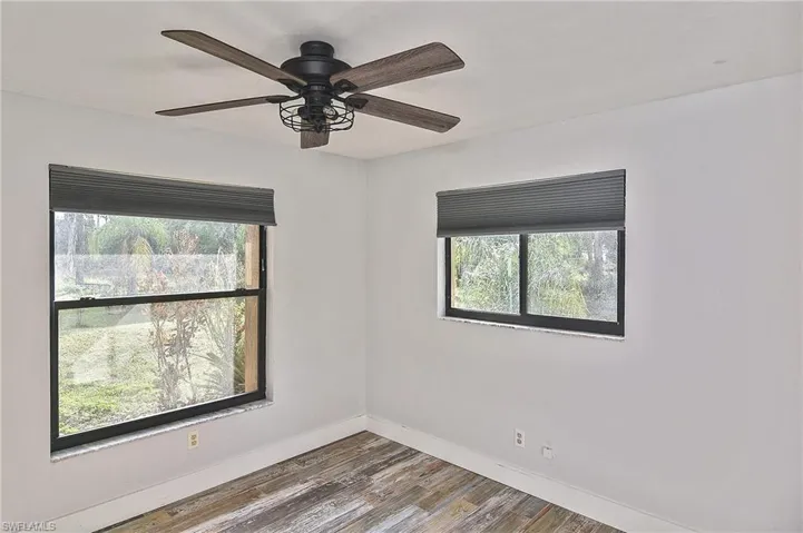Unfurnished room featuring wood-type flooring