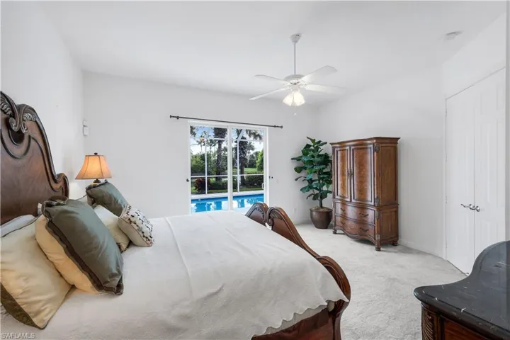 Bedroom with carpet floors, access to outside, a ceiling fan, and a closet