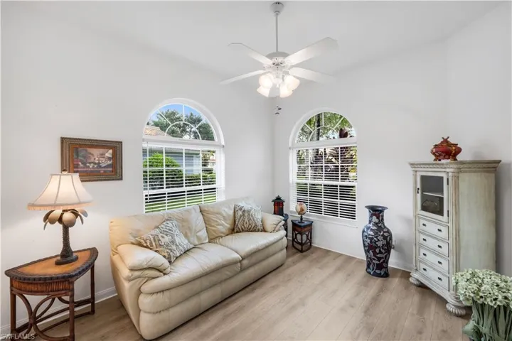 Living area featuring light wood-style flooring and a ceiling fan