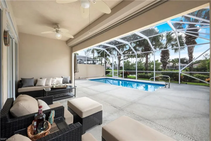 Outdoor pool with a patio area, an outdoor hangout area, a sunroom, a lanai, and ceiling fan
