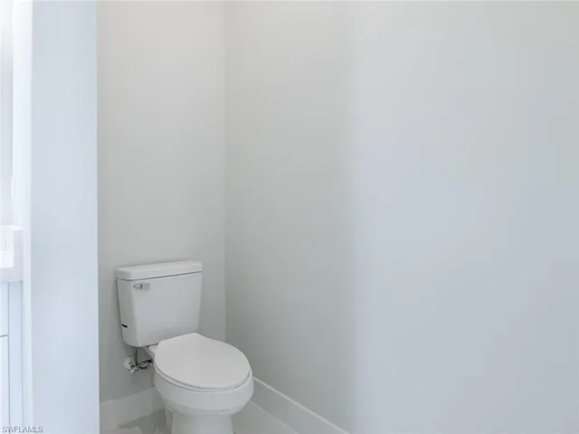 Bathroom featuring toilet and tile patterned floors