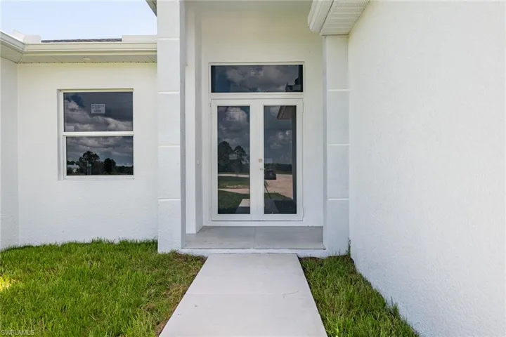 Doorway to property with french doors