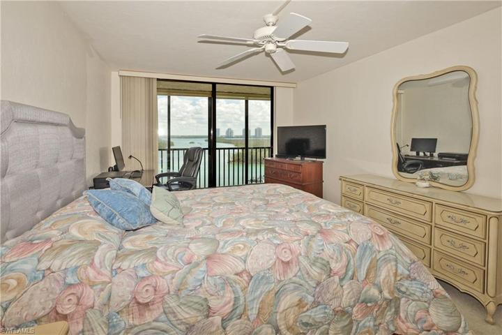 Main bedroom overlooking the bay and sliders out to the balcony.