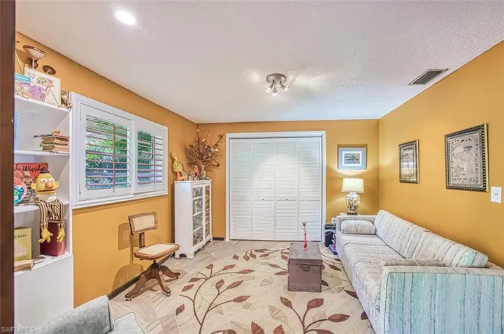 Sitting room featuring a textured ceiling