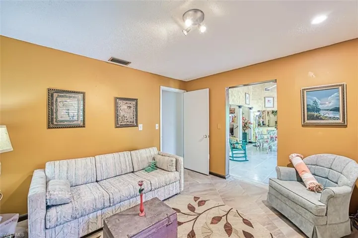 Living room featuring a textured ceiling