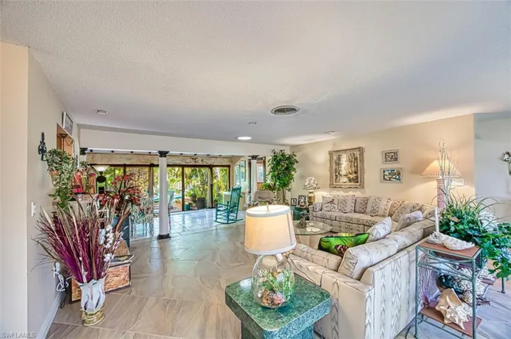 Living room featuring a textured ceiling