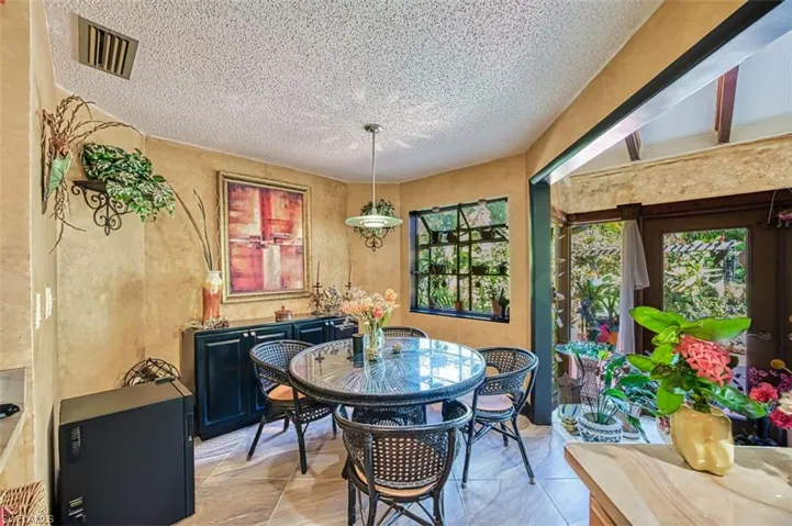 Dining area with a textured ceiling