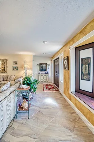 Hall featuring a textured ceiling
