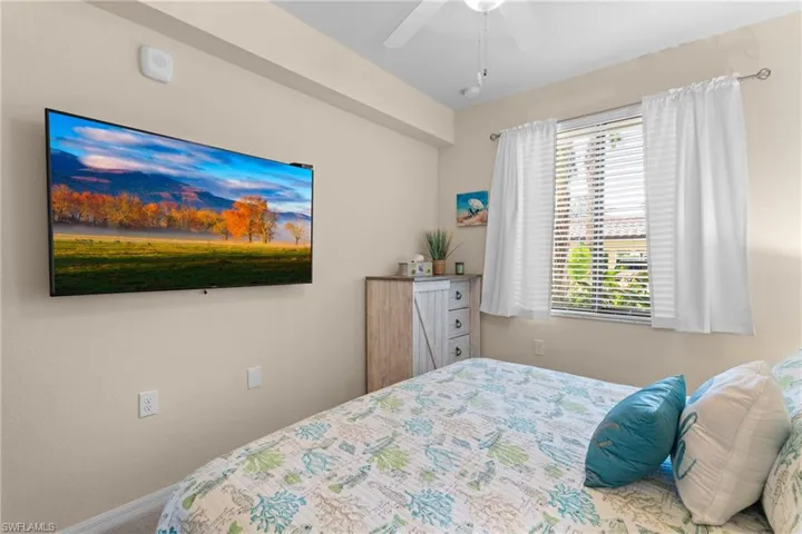Bedroom with baseboards and ceiling fan