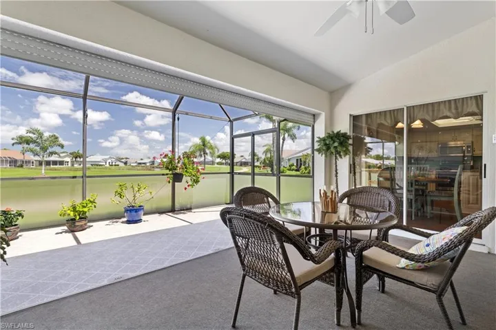 Sunroom / solarium with lofted ceiling and ceiling fan