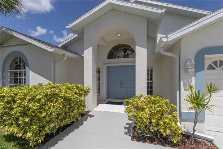 Property entrance with a 2 car garage