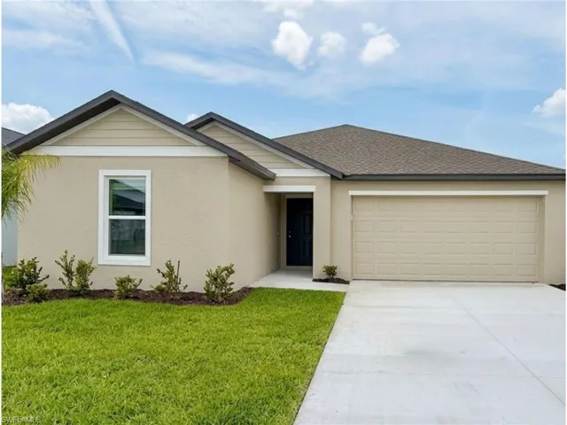 Beautiful front elevation with an attached two-car garage and professionally landscaped exterior.