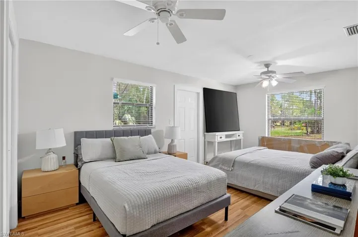 Bedroom with wood finished floors and ceiling fan