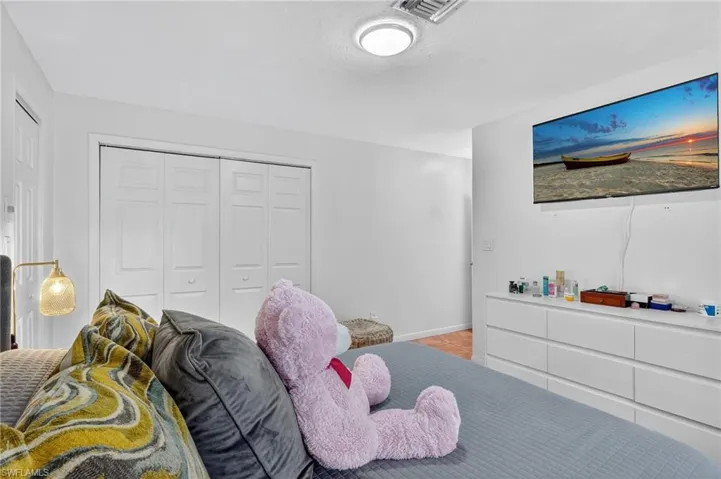 Bedroom with a closet and baseboards