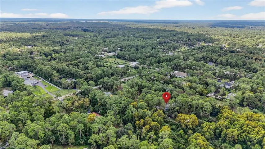 Aerial overview of property's location with a forest