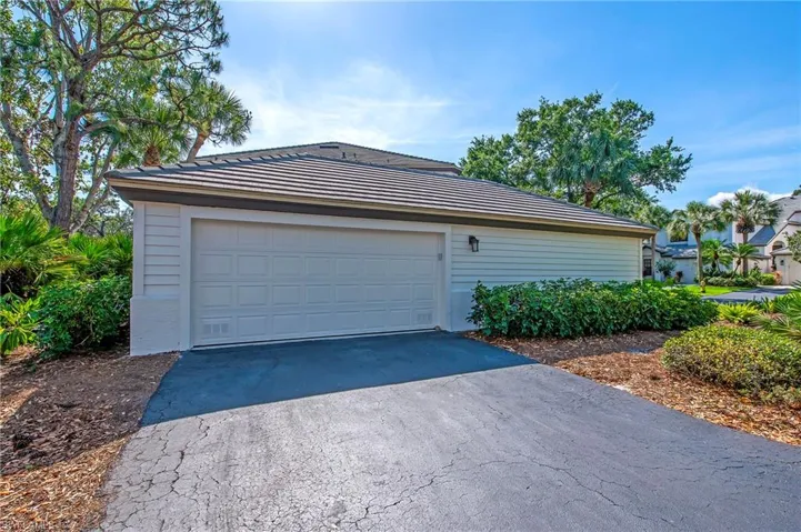 Detached 2 car garage with additional parking in the driveway and guest parking across the street.
