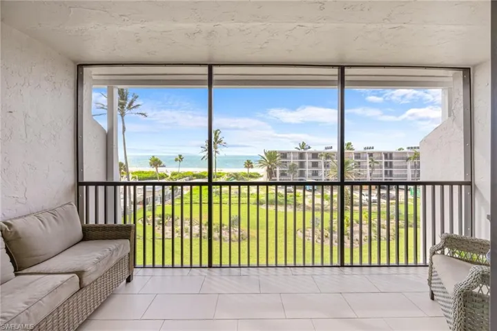 Sunroom with a water view