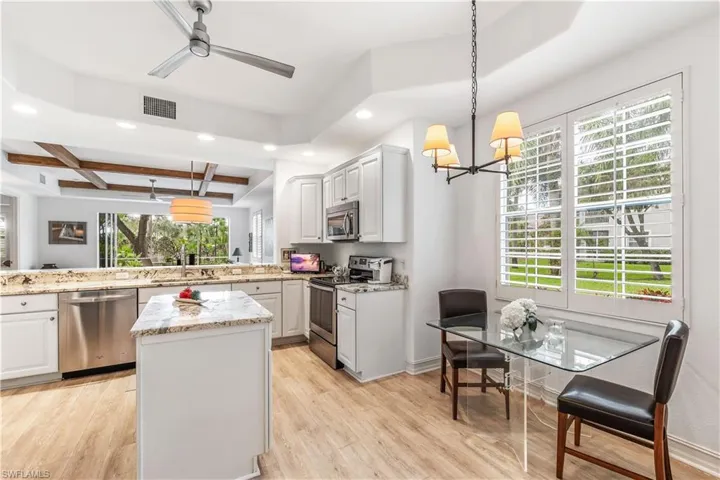 Updated kitchen with center island and casual dining
