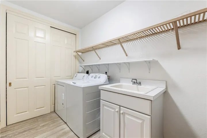 Spacious laundry room with utility sink