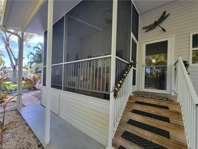 Property entrance featuring ceiling fan
