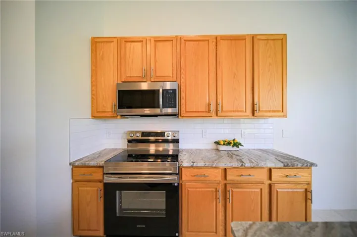 This Kitchen Is Equipped With New Stainless Steel Appliances, Brand New Textured (Brushed) Granite Countertops, New Sink And Fixtures, New Lighting, And An Oversized Walk-In Pantry!