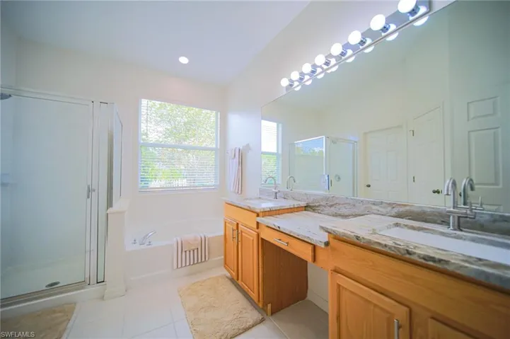 The Master Bathroom Comes With Brand New Granite Countertops, New Fixtures, New Lighting, And A Private Entrance To The Covered Back Lanai!