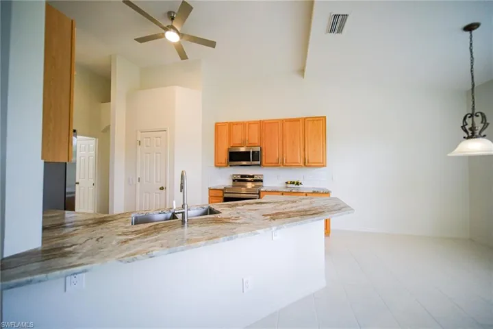 This Kitchen Is Equipped With New Stainless Steel Appliances, Brand New Textured (Brushed) Granite Countertops, New Sink And Fixtures, New Lighting, And An Oversized Walk-In Pantry!  Add Barstools And Increase Your Seating By Four Or Five People!