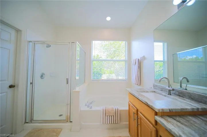 The Master Bathroom Comes With Brand New Granite Countertops, New Fixtures, New Lighting, And A Private Entrance To The Covered Back Lanai!