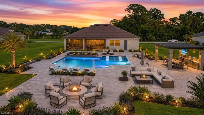 Artist's Rendering. Image is for illustrative purposes only and depicts a possible future backyard design. Swimming pool, outdoor kitchen, fire pit, landscaping, furnishings, lighting, and other features shown do not currently exist and are not included in the sale of the property. Buyers should verify all existing property features independently.