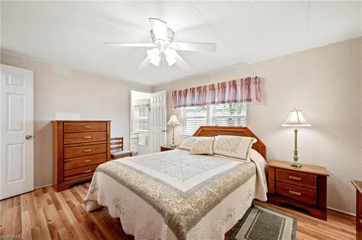 Bedroom with light wood-style flooring and ceiling fan