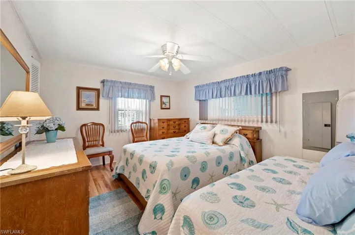 Bedroom with wood finished floors and ceiling fan
