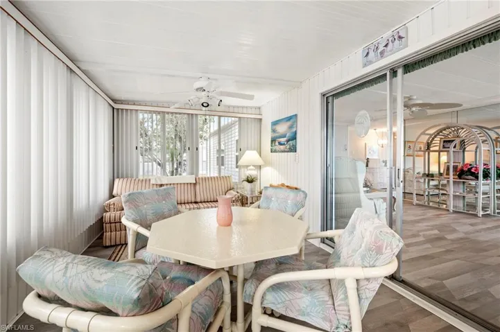 Sunroom featuring ceiling fan