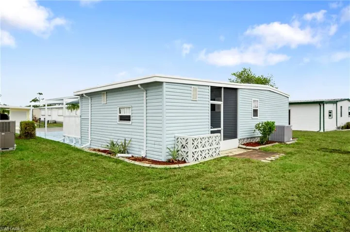 View of outbuilding featuring central air condition unit