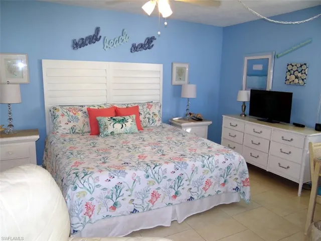 Bedroom featuring a ceiling fan and light tile patterned flooring