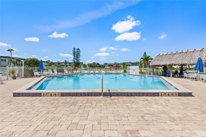 Community pool featuring a patio
