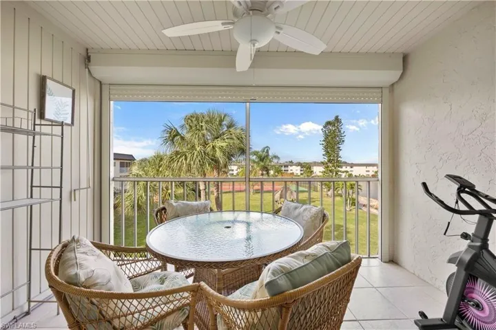 Balcony with ceiling fan and outdoor dining space