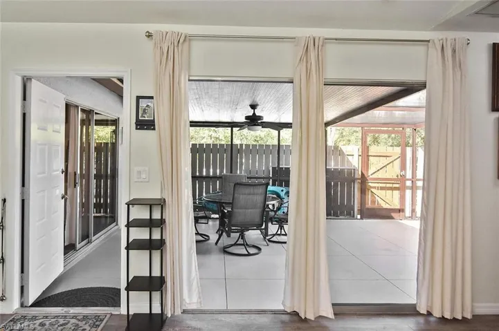 Entryway featuring ceiling fan and tile patterned flooring