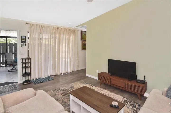 Living area featuring wood finished floors and baseboards