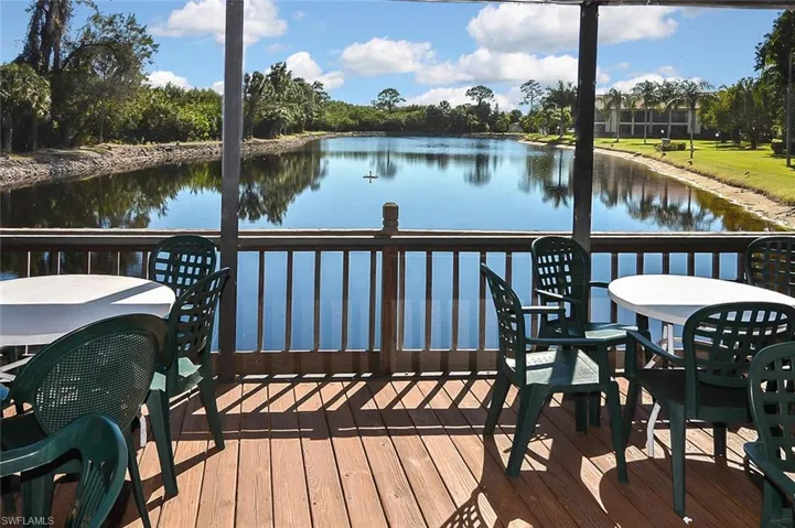 Deck featuring a water view and outdoor dining space